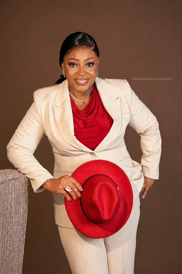 Power glam makeover in cream suit with red fedora